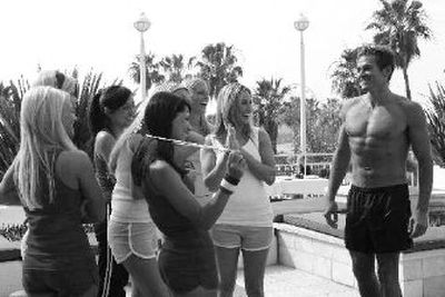 
In this undated photo provided by ABC, bachelor Andy Baldwin, a doctor and Navy lieutenant, meets with a cluster of marriage-minded women competing to be his bride on the network's 