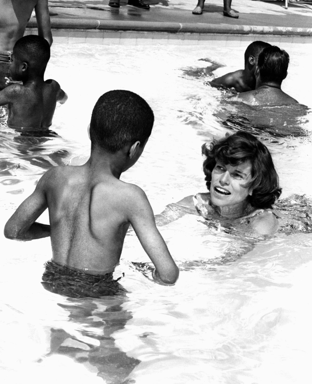 In a 1964 photo, Eunice Kennedy Shriver swims  with youngsters at a day camp for children with mental disabilities.  (File Associated Press / The Spokesman-Review)