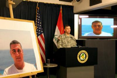 
U.S. military spokesman in Iraq Maj. Gen. William Caldwell speaks Thursday during a press conference in Baghdad's Green Zone, flanked by images of a missing U.S. soldier.
 (Associated Press / The Spokesman-Review)