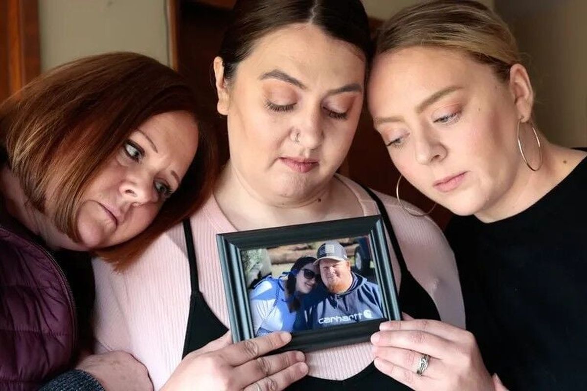 Mackenzie Ammons, center, is comforted by her mom, Tracy Bevard, left, and sister, Maddie Adams, on Friday in Longview, Wash. Ammons’ husband, Jared, died in the implosion at the Nippon Dynawave Packaging Co. mill.  (Seattle Times)