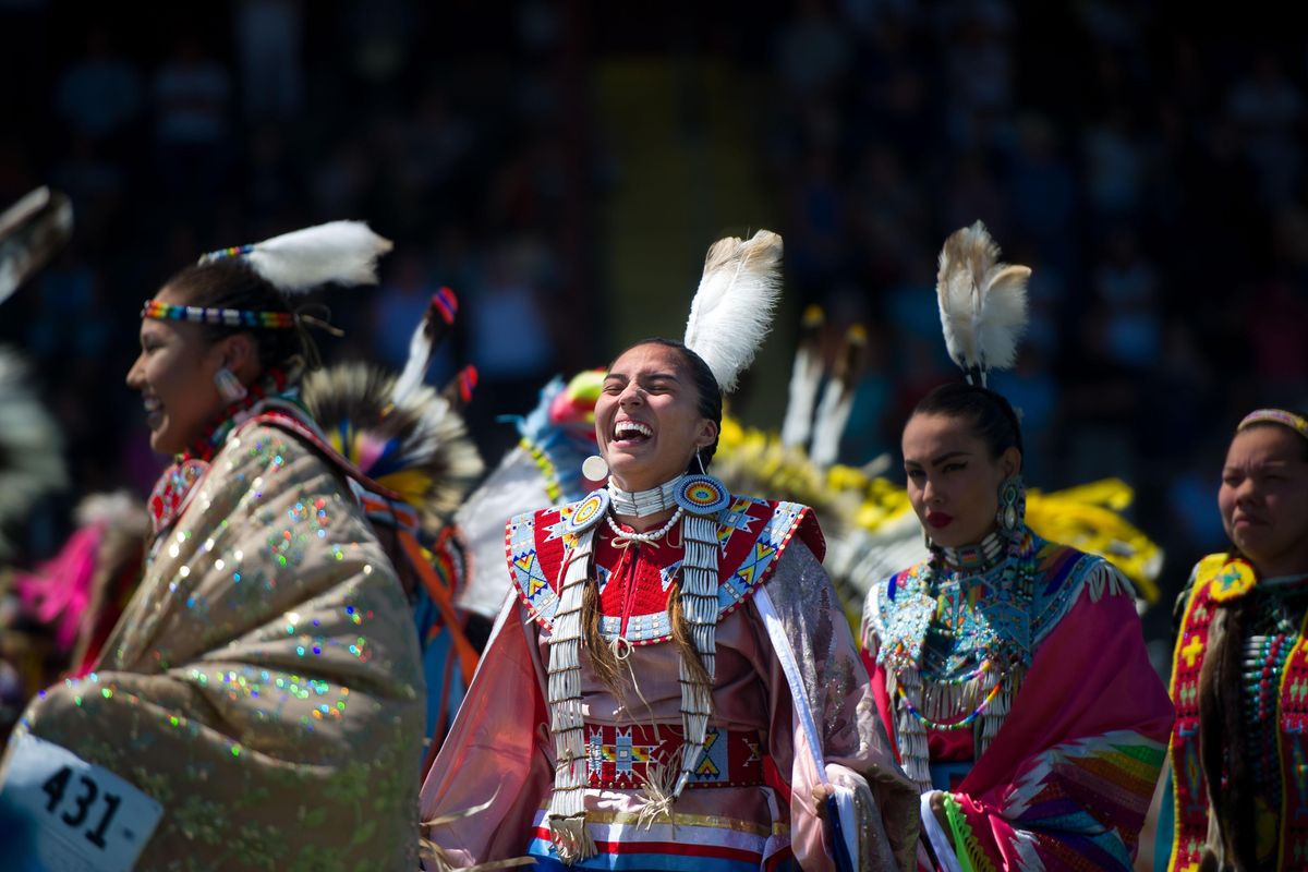 Keya Clairmount laughs as she dances during the 2017 Coeur d’Alene Tribal Encampment and Julyamsh Powwow on Friday, July 21, 2017, at the Kootenai County Fairgrounds in Coeur d’Alene, Idaho. (Tyler Tjomsland / The Spokesman-Review)