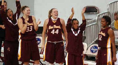 Sun Devils players celebrate a 3-pointer in their win.
(Associated Press / The Spokesman-Review)