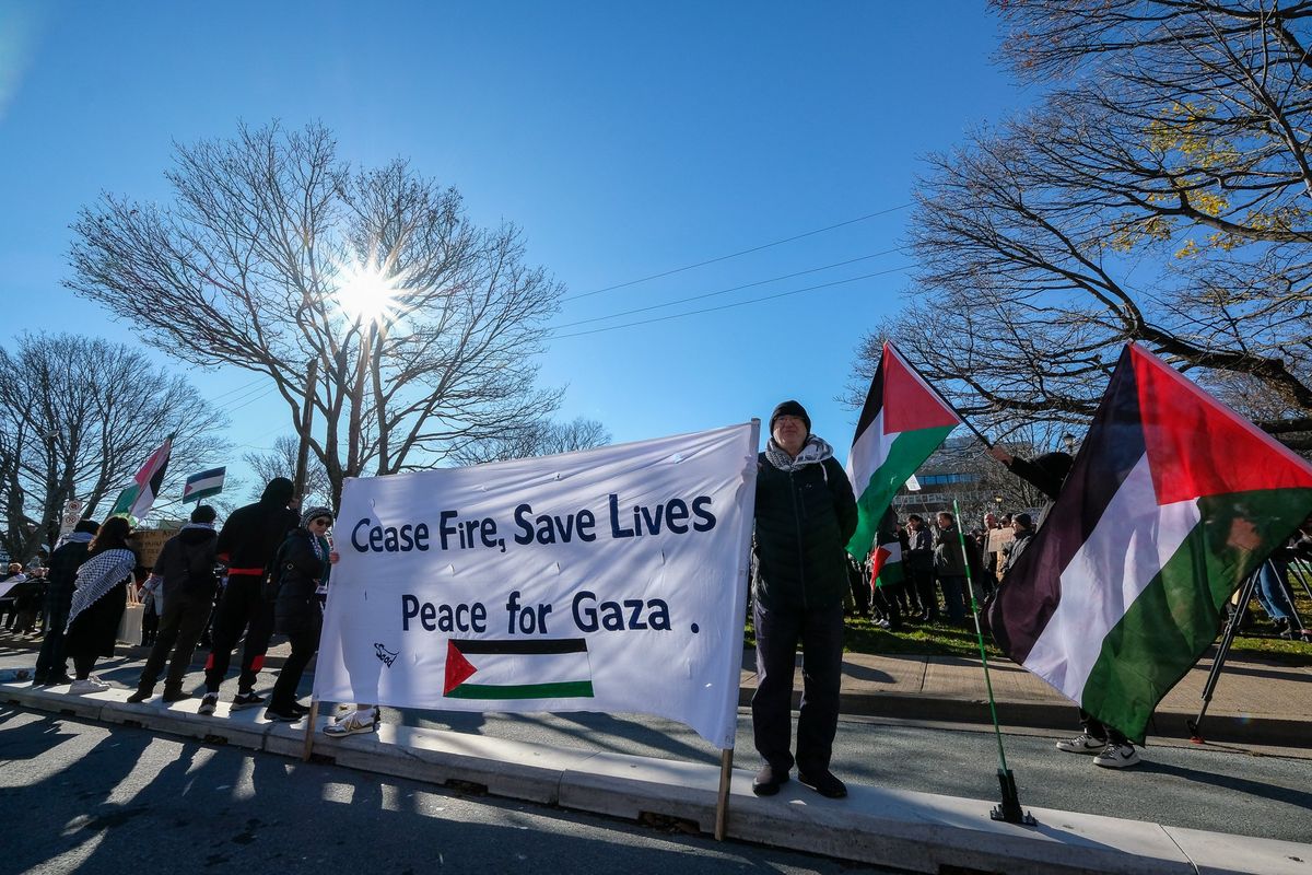 Pro-Palestinian protesters call for a cease-fire in the Israel-Hamas war on Sunday outside the Westin Nova Scotian hotel in Halifax, Nova Scotia, host of the Halifax International Security Forum.  (Orion Donovan Smith/The Spokesman-Review)