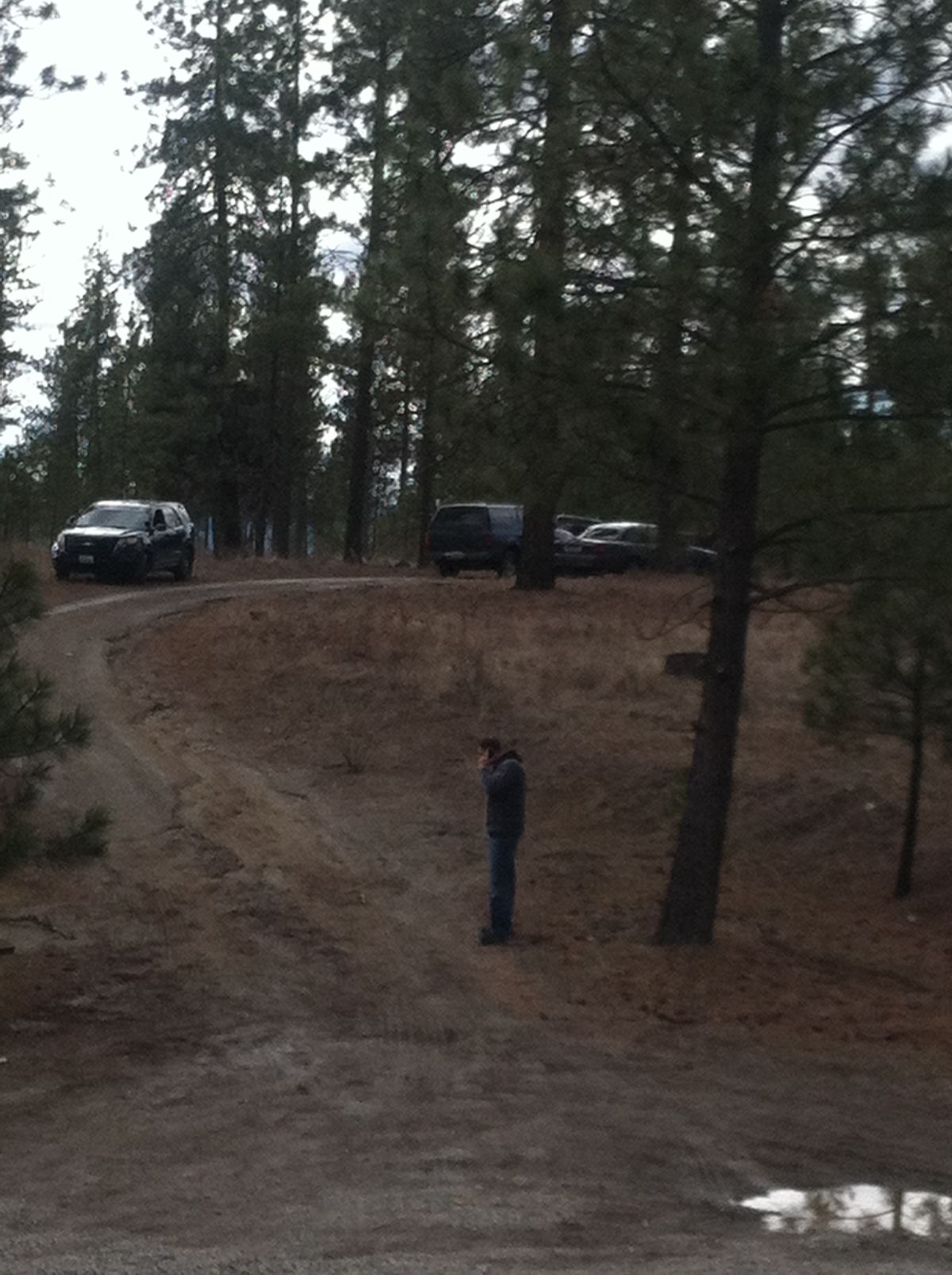 Spokane Police detectives are investigating a body found off Corkscrew Canyon Road north of Tum Tum on Marcy 7, 2014.  (Nina Culver)