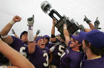 
Mike Pancich (3) of Carroll College leads the championship cheers Saturday, surrounded by Saints teammates Kendall Selle, left, and A.J. Porrini, right. 
 (Associated Press / The Spokesman-Review)