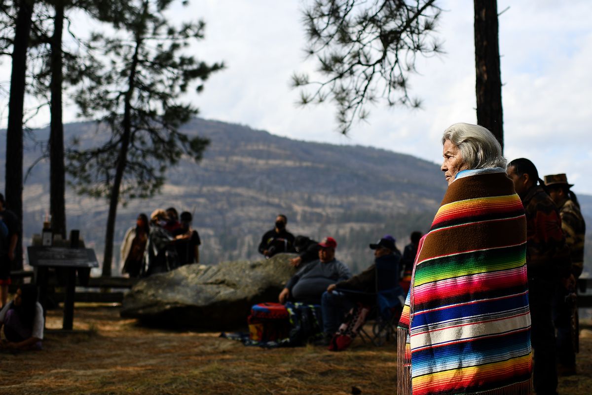 Yvonne L. Swan stands with Colville Confederated Tribe members and supporters during a gathering at the Sharpening Stone - a rock where generations of tribal members would sharpen their knives before hunting or fishing together - in support of Rick Desautel