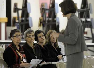 Spokane Public Schools teachers’ mentors Gwen Sanders, Mary Frankhauser, Erin Jordan and Gail Jessett listen to Superintendent Nancy Stowell discuss the district’s budget cuts during a meeting Tuesday at Chase Middle School. The mentoring program is proposed for cuts.  (Dan Pelle / The Spokesman-Review)