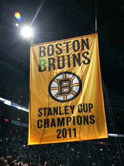 Boston raised its championship banner Thursday before losing its NHL season opener to the Philadelphia Flyers. (Associated Press)