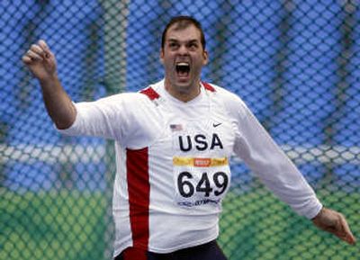 
Associated Press Michael Robertson of the United States reacts after his throw in the men's discus throw. Robertson won the gold medal.
 (Associated Press / The Spokesman-Review)