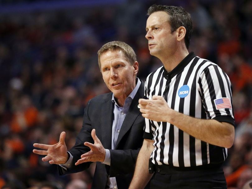 In this March 25, 2016, file photo, Gonzaga's head coach Mark Few argues a call with an official during the second half of a college basketball game against Syracuse in the regional semifinals of the NCAA Tournament in Chicago. Few tells The Associated Press Friday, April 1, 2016, that the NCAA called to inform him officials blew the call on a 10-second violation that went against the Bulldogs late in Syracuse's come-from-behind win in the Sweet 16. Refs called a 10-second violation but the 10-second limit in the backcourt should have reset once a player touched the ball in the front court. (Charles Rex Arbogast / AP)