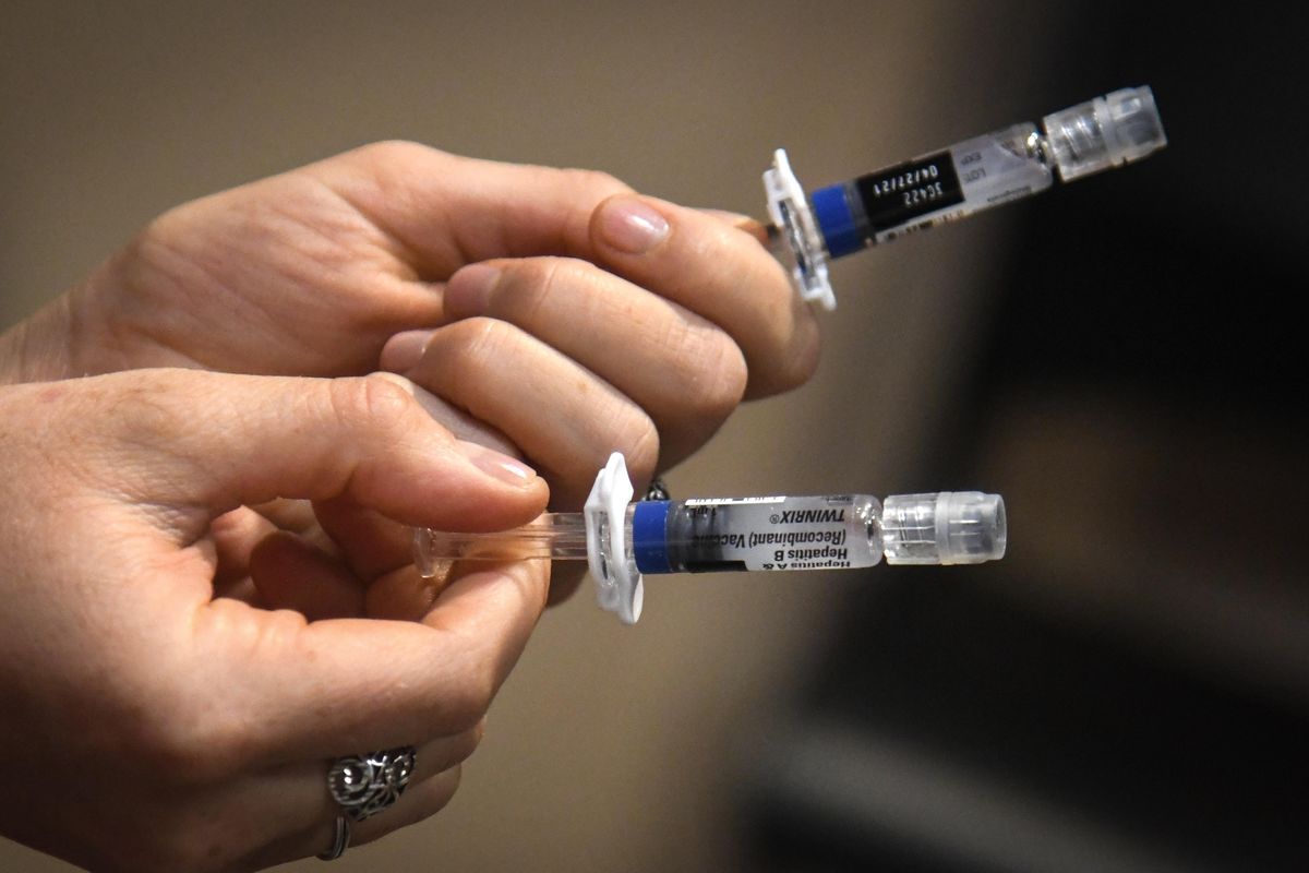 Spokane Regional Health District nurse Kira Lewis prepares hepatitis vaccinations Tuesday, Aug. 6, 2019, at the House of Charity in Spokane, Wash. (Dan Pelle / The Spokesman-Review)