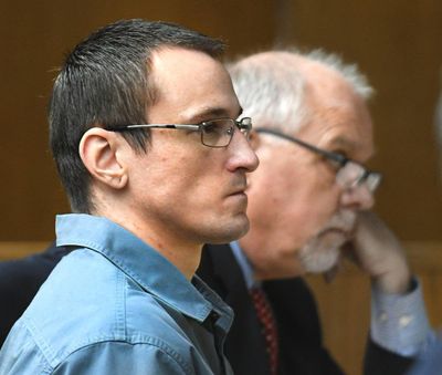 Daniel Alldrin (left) and his attorney, James Seibe, listen to the opening statement by Clearwater County Deputy Prosecutor Lori Gilmore on Tuesday in 2nd District Court at Lewiston. (Barry Kough / Lewiston Tribune)