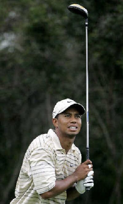 
Tiger Woods watches his drive from the 10th tee during the third round of the PGA Championship.  
 (Associated Press / The Spokesman-Review)