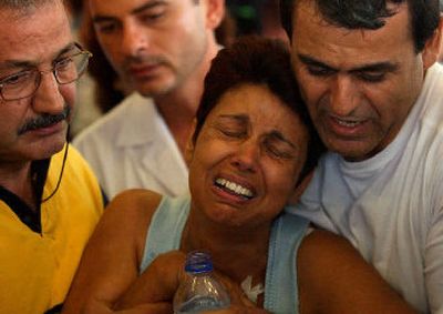 
A mother cries as she waits in Larnaca, Cyprus, international airport for news of her loved ones who were aboard the airliner that crashed. 
 (Associated Press / The Spokesman-Review)