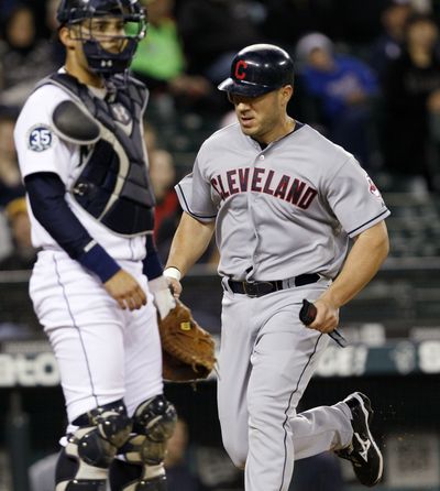 Cleveland’s Travis Hafner scores in the seventh inning Tuesday. (Associated Press)