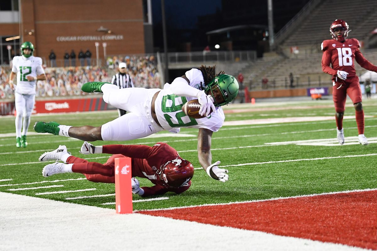 Oregon Ducks tight end DJ Johnson (89) dives into the end zone for a touchdown against WSU during the first half of a college football game on Saturday, November 14, 2020, at Martin Stadium in Pullman, Wash.  (Tyler Tjomsland/The Spokesman-Review)