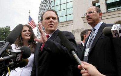 
Richard Scrushy with his wife Leslie, left, and attorney Donald Watkins, right, speak to reporters Tuesday, after jurors acquitted Scrushy of all charges. 
 (Associated Press / The Spokesman-Review)