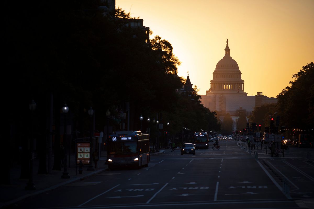 FILE -- The sun rises over the U.S. Capitol and Pennsylvania Avenue in Washington, on Thursday, Oct. 20, 2022. A Republican takeover of the House or Senate in the midterm elections next week could complicate the Biden administration