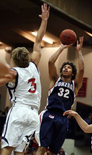 Gonzaga's Steven Gray (32) shoots over St. Mary's Mitchell Young of Australia, in the first half of an NCAA college basketball game, Thursday, Jan. 14, 2010 in Moraga, Calif. (Dino Vournas / Fr66998 Ap)