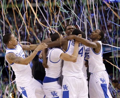 Kentucky players celebrate at the end of the NCAA Final Four tournament college basketball championship game against Kansas Monday, April 2, 2012, in New Orleans. Kentucky won 67-59. (David Phillip / Associated Press)