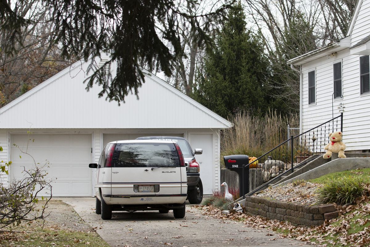A lone teddy bear sits on the steps of the home in Toledo, Ohio, Tuesday Nov. 13, 2012.  Three children, their uncle, and their grandmother were found dead inside the garage at the house Monday in what appears to be a murder-suicide amid a custody dispute. (Rick Osentoski / Fr170444 Ap)