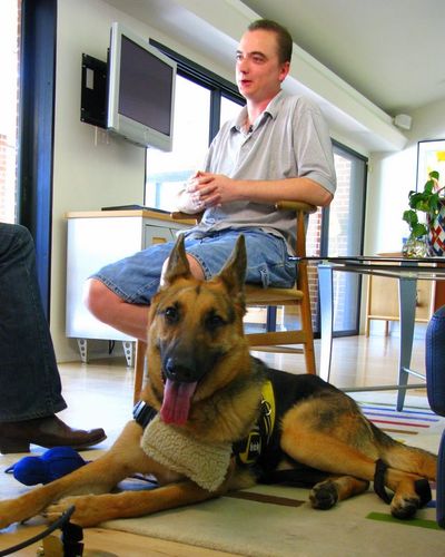 Joe Stalnaker  sits with his German shepherd, Buddy, on Friday.  (Associated Press / The Spokesman-Review)