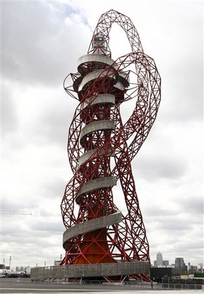 The ArcelorMittal Orbit sculpture before its official unveiling at the Olympic Park, London, Friday May 11, 2012. The steel sculpture designed by Anish Kapoor and Cecil Balmond stands 114.5 meters (376 feet) high, 63 percent of the sculpture is recycled steel and incorporates the five Olympic rings.  (Tim Hales/Associated Press)