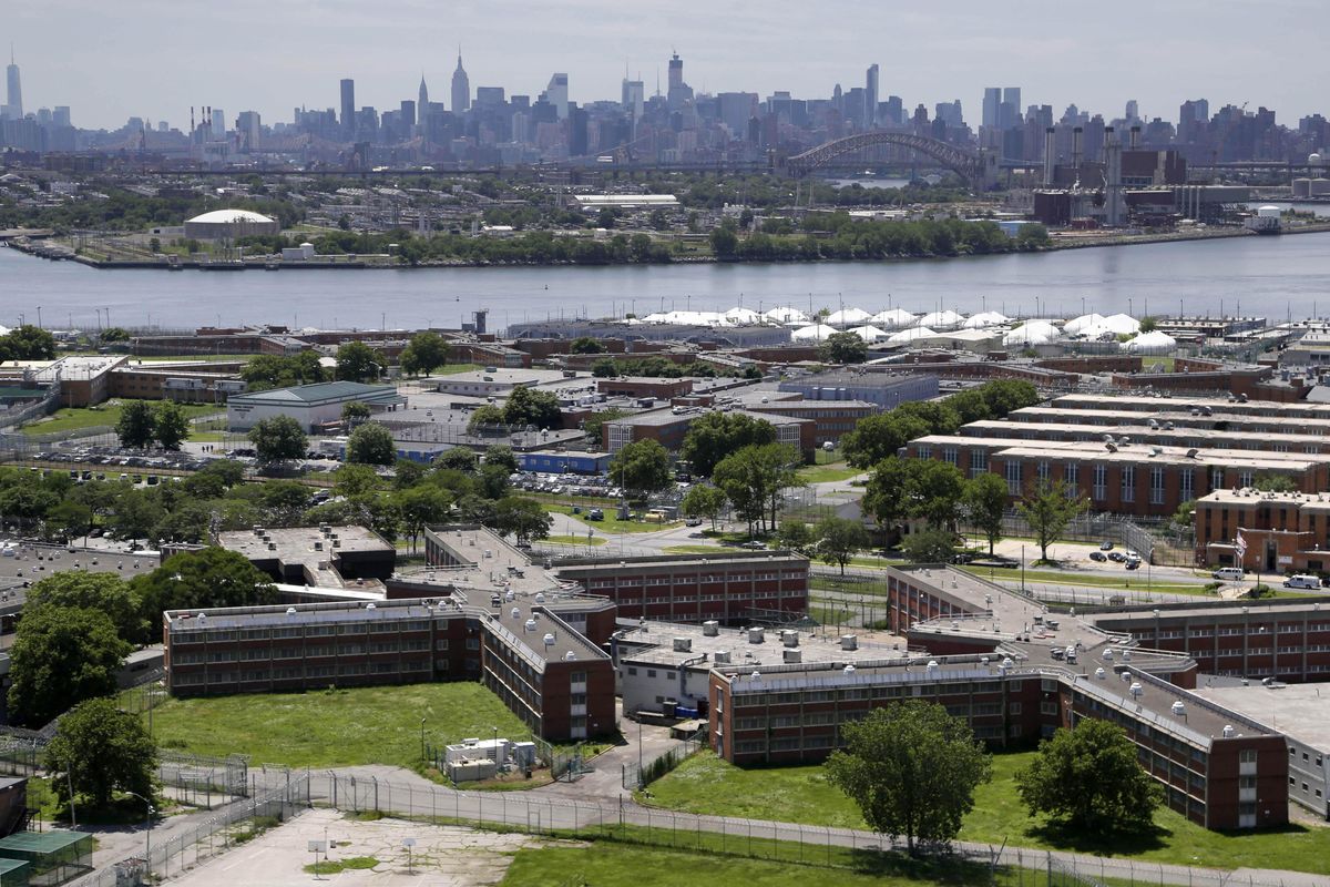In this this June 20, 2014,  photo, the Rikers Island jail complex stands in the foreground with the New York skyline in the background. Inmate activists, for more than a year, have argued that shutting down the sprawling, 10-jail complex in the East River is the only solution for a cycle of abuses that include violence by guards and gang members, mistreatment of the mentally ill and juveniles, and unjustly long detention for minor offenders. (Seth Wenig / Associated Press)