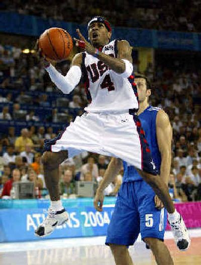 
Allen Iverson of the United States shoots after being fouled by Greece's Theodoros Papaloukas in the second half. 
 (Associated Press / The Spokesman-Review)