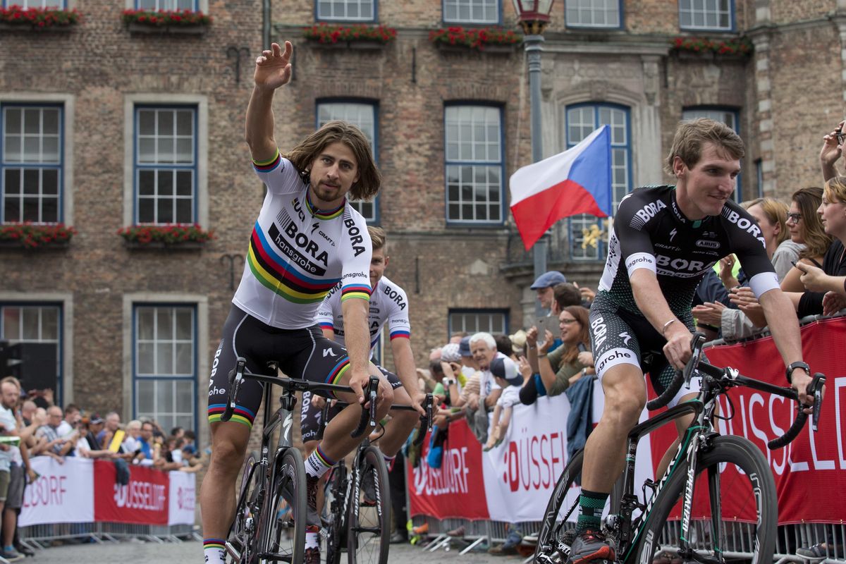 Peter Sagan of Slovakia is followed by his brother Juraj as he waves to spectators during the team presentation of the Tour de France cycling race in the center of Duesseldorf, Germany, Thursday, June 29, 2017. (Peter Dejong / Associated Press)