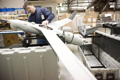 Jim McClanahan assembles an unmanned surveillance aircraft at the Insitu production facility in Bingen, Wash., on April 23. (Associated Press / The Spokesman-Review)