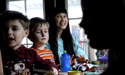 Iris Siegler, of Iris’ House preschool, talks with the children during lunch  in Coeur d’Alene on  March 18. She has been in the field of early childhood education for 39 years.  (Kathy Plonka / The Spokesman-Review)