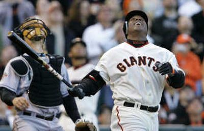 Barry Bonds of the Giants, still in pursuit of Hank Aaron, pops out in the third inning. Associated Press
(Associated Press / The Spokesman-Review)