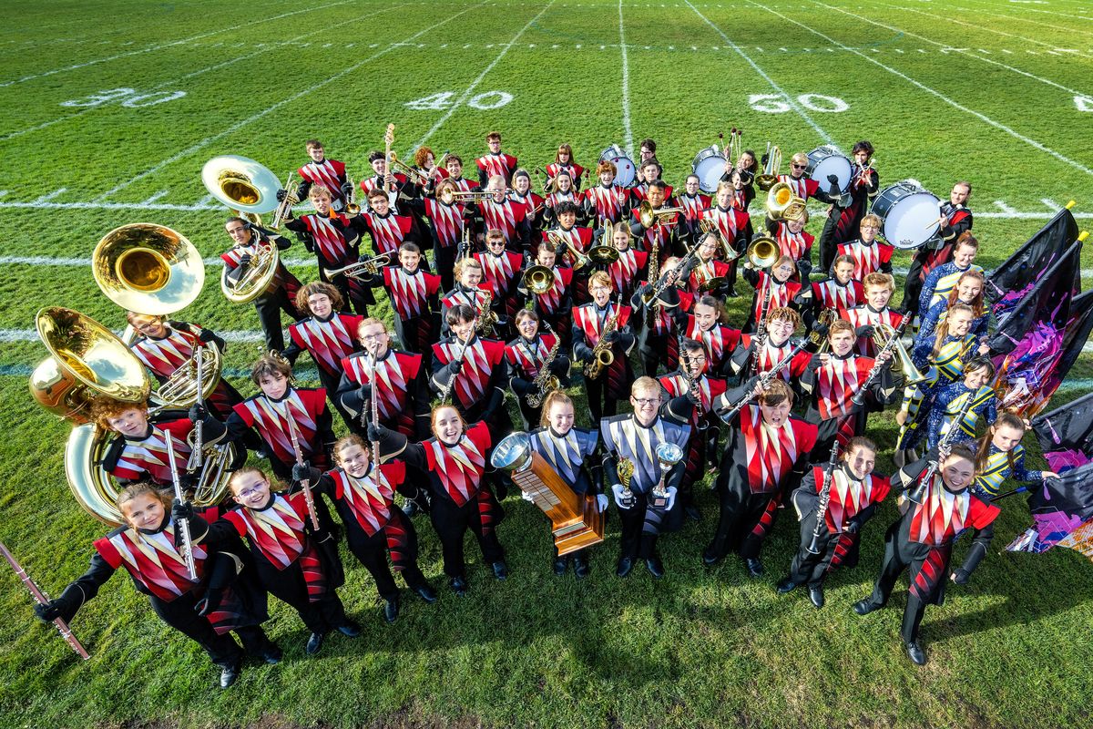 Cheney High School Marching Band members celebrate their sweepstakes win at the Puget Sound Festival of Bands last weekend in Everett.  (COLIN MULVANY/THE SPOKESMAN-REVIEW)
