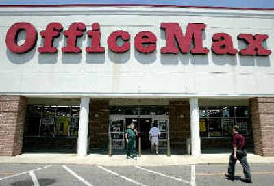 
Shoppers walk in and out of an Office Max store    in Columbus, Ohio. 
 (Associated Press / The Spokesman-Review)