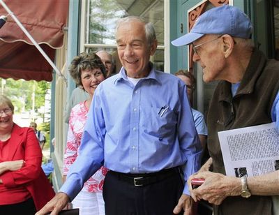 Republican presidential candidate Rep. Ron Paul, R-Texas, campaigns in Freedom, N.H., on July 1. Paul says he will retire from Congress when his term ends in 2012 and will focus on his campaign for president.  (Associated Press)