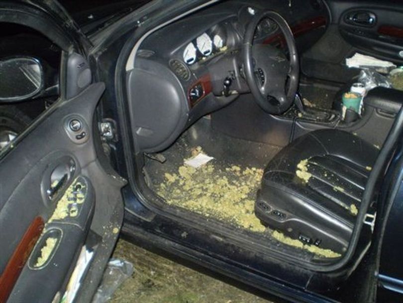 This Dec. 13, 2011 photo released by the Oregon State Police shows the interior of a car driven by two men arrested Monday night after leading Oregon State Trooper Clay Core on a 100 mph chase along Interstate 5 south of Eugene, Ore., while ripping open half-pound bags and flinging marijuana buds out the window. Troopers and deputies recovered approximately 5 pounds of marijuana along the roadway and from the car. Core says that the pot was 