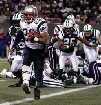 
Patriots running back Corey Dillon scores a second-quarter touchdown against the Jets. 
 (Associated Press / The Spokesman-Review)