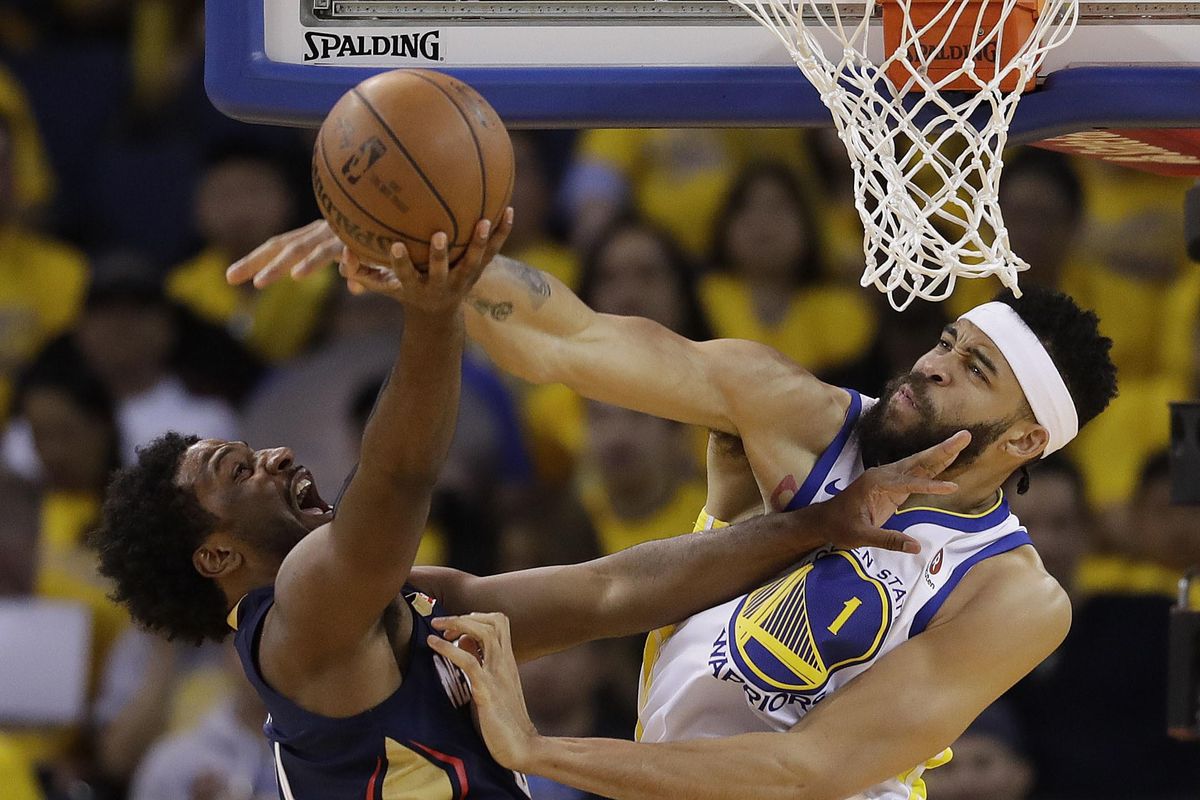 Golden State Warriors’ JaVale McGee, right, blocks a shot from New Orleans Pelicans’ Solomon Hill during the second half in Game 1 of an NBA basketball second-round playoff series Saturday, April 28, 2018, in Oakland, Calif. (Marcio Jose Sanchez / Associated Press)