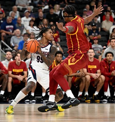 Gonzaga guard Khalif Battle (99) drives the ball to the key as USC forward Saint Thomas (0) defends during a college exhibition basketball game, Sat. Oct. 26, 2024, at the Acrisure Arena in Palm Desert, California.  (COLIN MULVANY/THE SPOKESMAN-REVIEW)