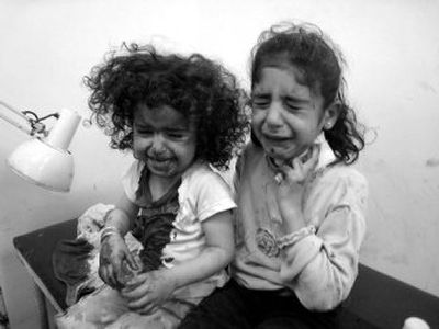 
Injured Iraqi girls cry at a hospital in Kirkuk, Iraq, on Monday. 
 (Associated Press / The Spokesman-Review)