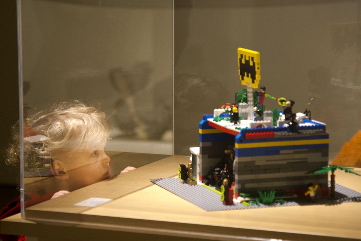 Jameson Haffey, 2, appears fascinated by one of the many small-scale LEGO projects entered into the Northwest Museum of Arts and Culture