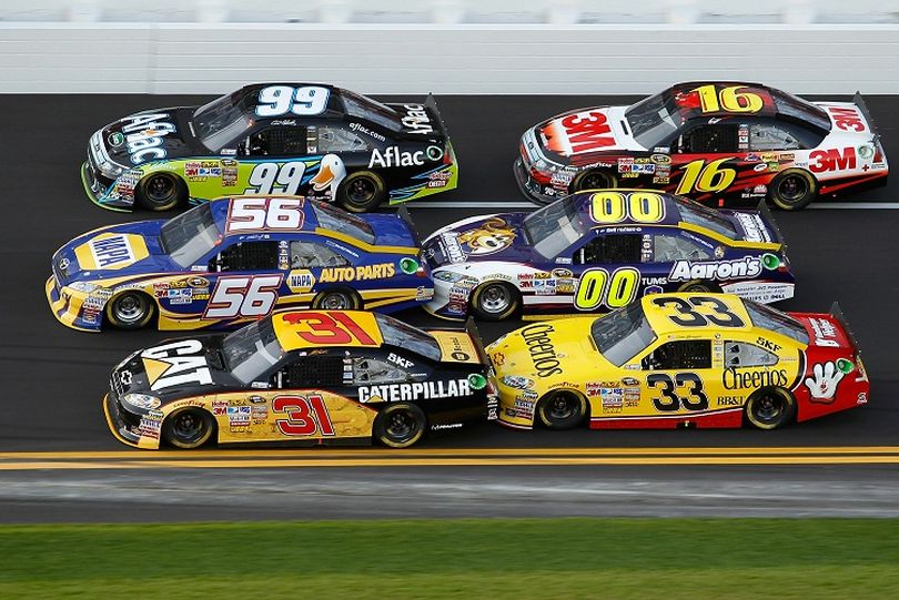 Three wide racing as Carl Edwards, Greg Biffle, Martin Truex Jr., David Reutimann, Jeff Burton and Clint Bowyer draft during the Gatorade Duel at Daytona International Speedway in Daytona Beach, Fla.  (Photo Credit: Todd Warshaw/Getty Images for NASCAR) (Todd Warshaw / Getty Images North America)