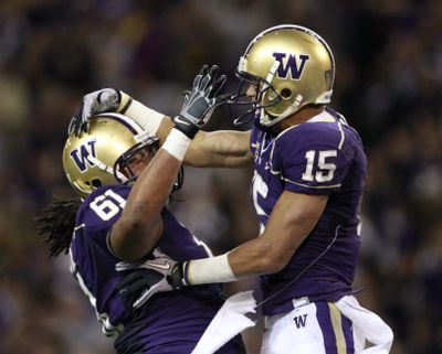Jermaine Kearse, right, celebrates his second-quarter touchdown reception with Gregory Christine. (Associated Press)