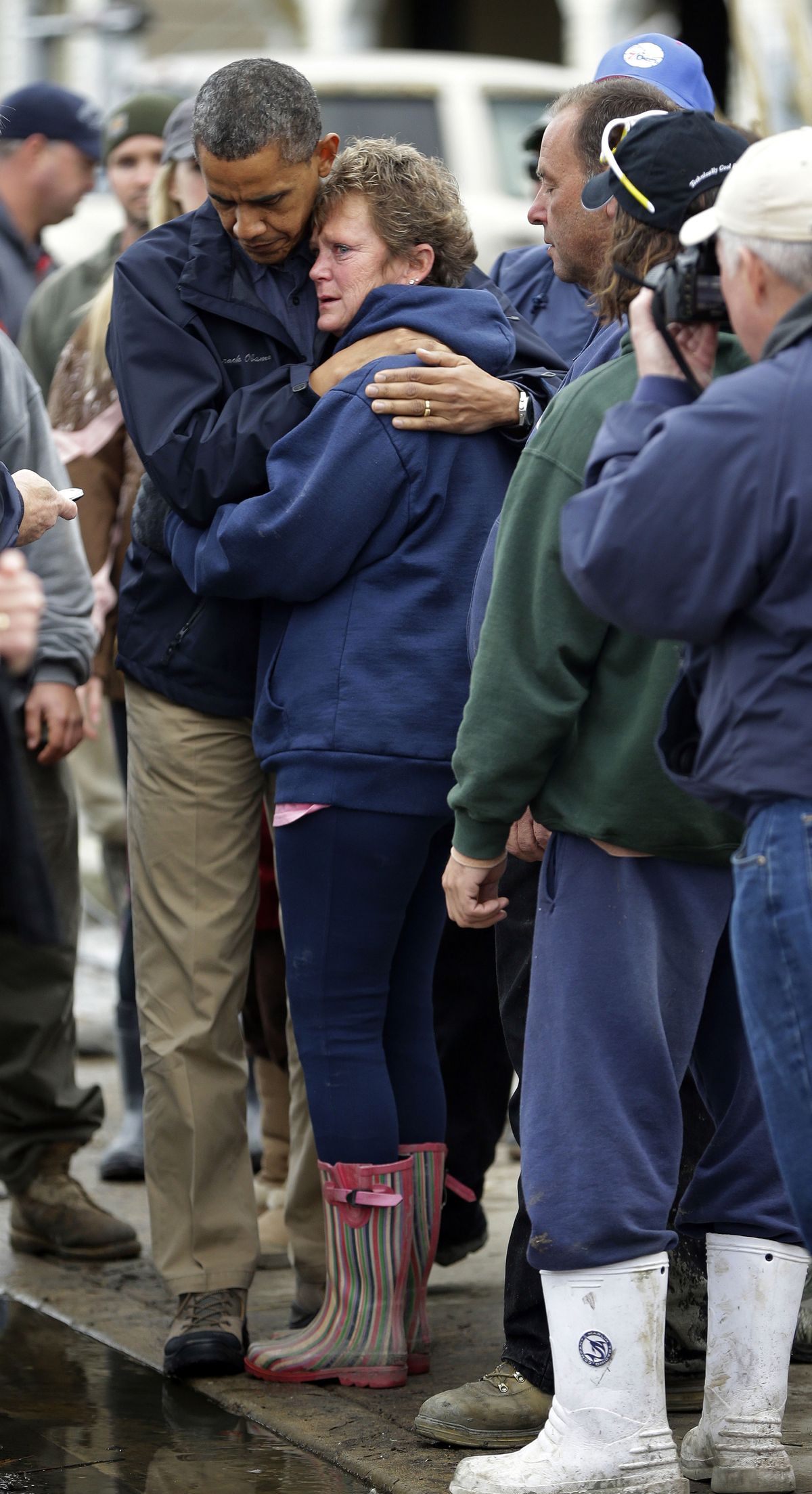 President Barack Obama, left, embraces Donna Vanzant, right, during a tour of an area effected by superstorm Sandy, Wednesday, Oct. 31, 2012, in Brigantine, N.J.  Vanzant is a owner of North Point Marina, which was damaged by the storm. (Pablo Monsivais / Associated Press)
