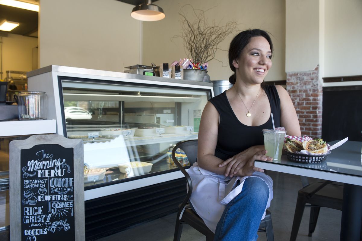 Kristen Ward, owner of The Ivory Table, sits in her new restaurant at 1822 E. Sprague Ave. in the International District. The restaurant serves breakfast and lunch. (Jesse Tinsley)