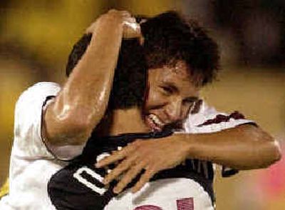 
Former Spokane Shadow star Brian Ching is congratulated by Landon Donovan after scoring against Jamaica Aug. 18.
 (Associated Press / The Spokesman-Review)