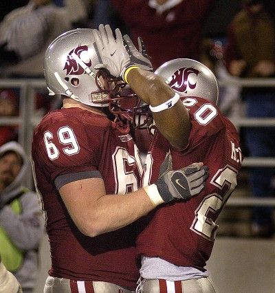 WSU offensive lineman #69 Kenny Alfred congratulates running back #20 Kevin McCall after he scored a touchdown against Stanford at Martin Stadium in Pullman Saturday November 10, 2007.  CHRISTOPHER ANDERSON The Spokesman-Review (Christopher Anderson / The Spokesman-Review)