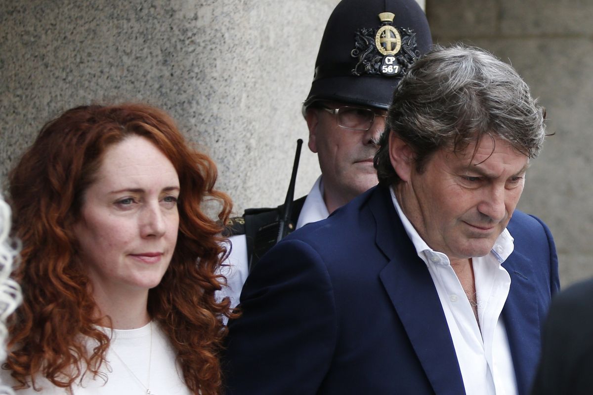 Rebekah Brooks, accompanied by her husband Charlie Brooks, leaves the Central Criminal Court on Tuesday. (Associated Press)