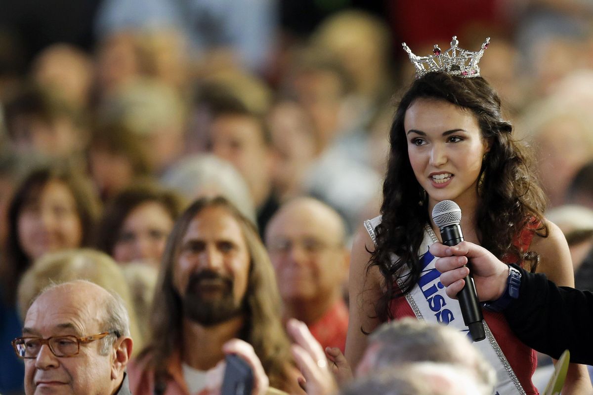 Miss America Teen Allie Nault  questions Republican presidential candidate Donald Trump during a  convention Monday in Manchester, N.H. (Jim Cole / Associated Press)